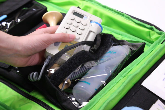 Close up of inside of the backpack holding medical equipment.