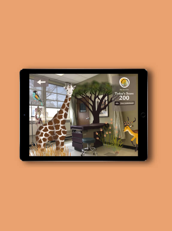 Image of tablet running 'Seedling' app which uses augmented reality to transform doctor's offices into one of Earth's biomes.