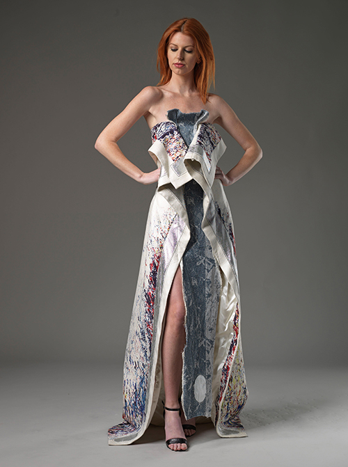Image of woman standing in fashion dress.