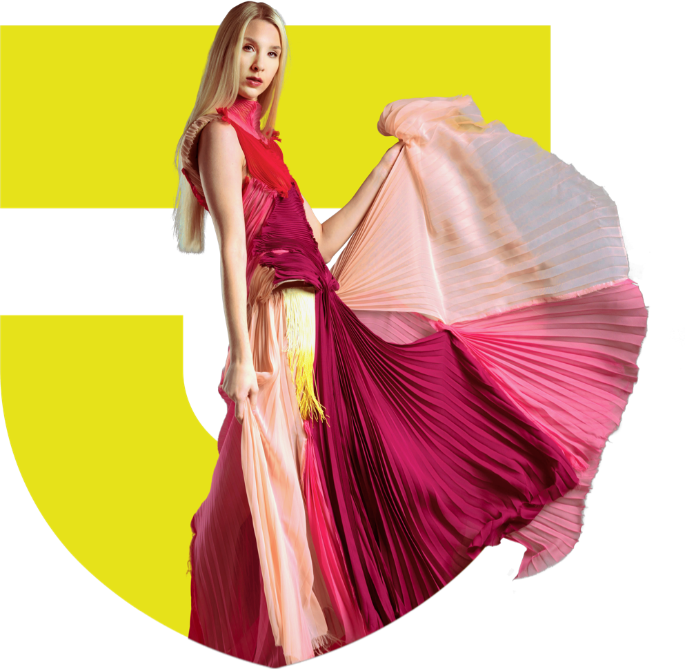 Image of model in long, flowing dress in fron of a yellow Thomas Jefferson University logo.